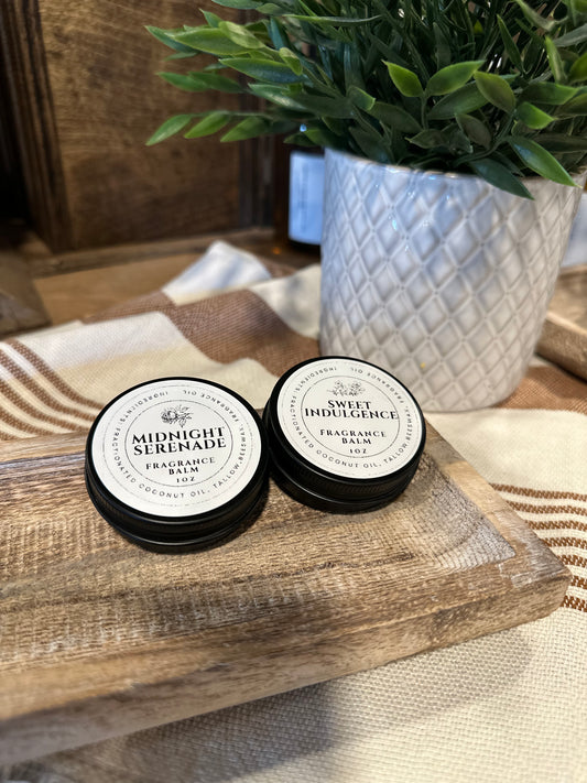 Midnight Serenade and Sweet Indulgence Fragrance Balm on wood tray