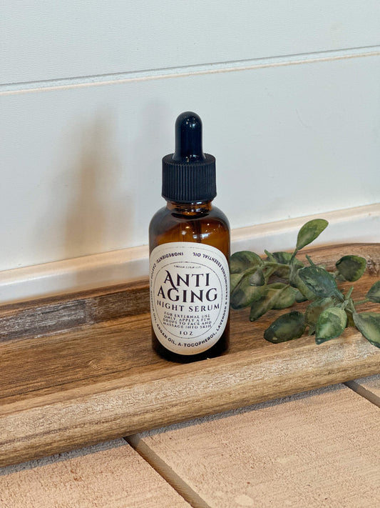 Anti Aging Night Serum bottle on wooden tray
