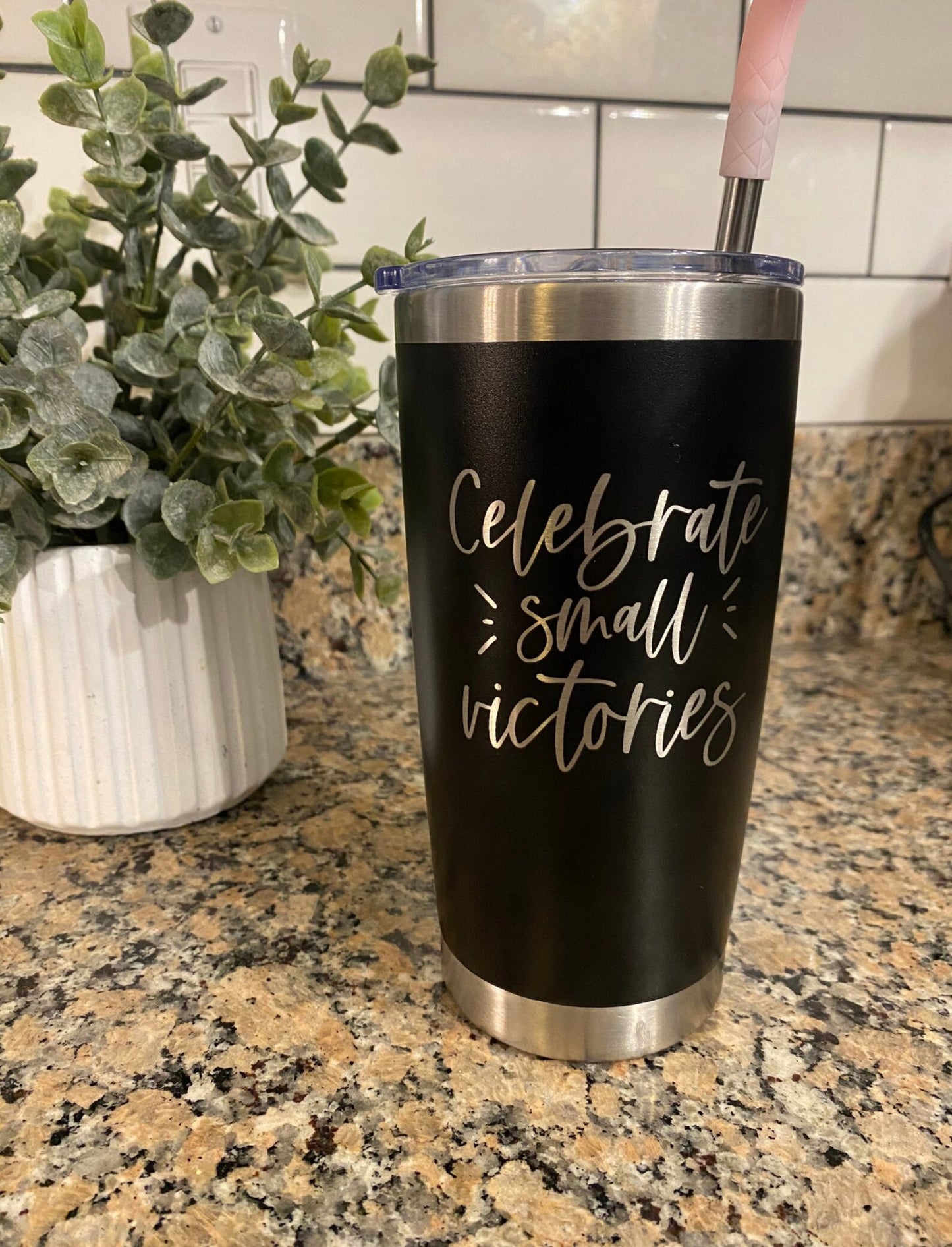 Celebrate small victories black tumbler on counter
