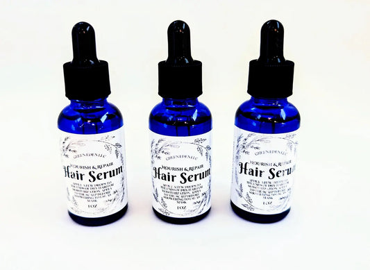 Three Nourish & Repair Hair Serum bottles on White Background