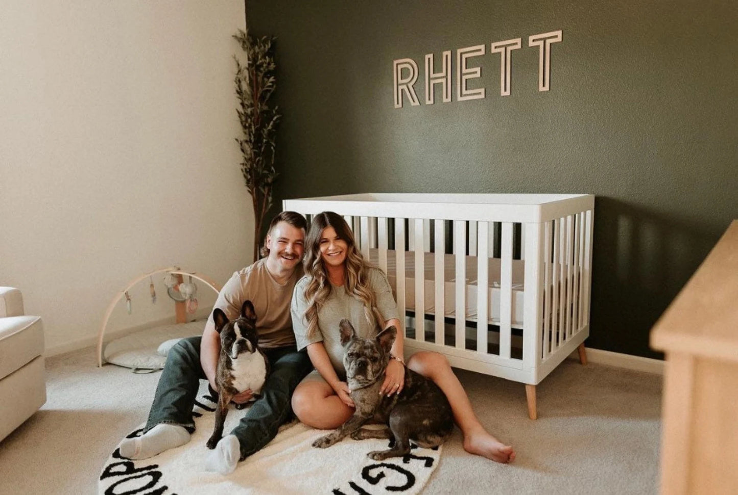 RHETT wood sign in nursery with family